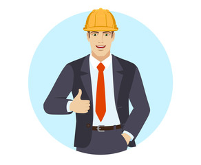 Businessman in construction helmet with hand in pocket  showing thumb up
