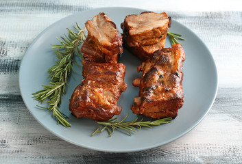 Delicious grilled ribs on plate
