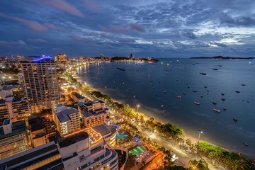 Naklejka premium Aerial View of Pattaya City and Beach at Twilight Sunset, Chonburi, Thailand. One of Most Popular Tourist Attraction in Thailand.