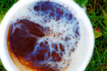 White coffee cup with interesting structure on the surface.