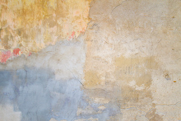 Old Cracked Weathered Shabby Yellow Painted Plastered Peeled Wall Background.