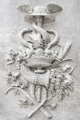 Bas-relief with snakes on a stone wall