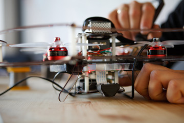 Picture of man with soldering iron repairing mechanism