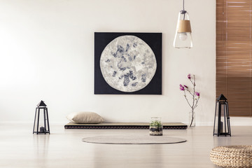 Bright and simple bedroom interior with asian style tatami mat bed, cherry blossom, moon painting...