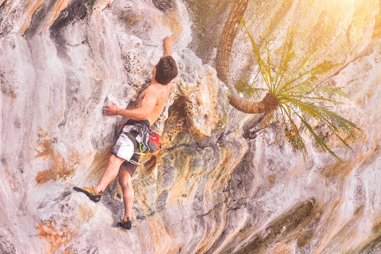 rock climber on a cliff on a sunny day