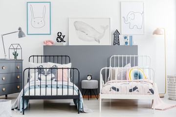 Simple style siblings bedroom interior with black and white beds. Rabbit, whale and elephant...
