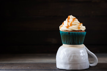 Caramel cupcakes on a dark background