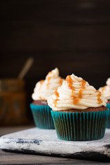 Caramel cupcakes on a dark background