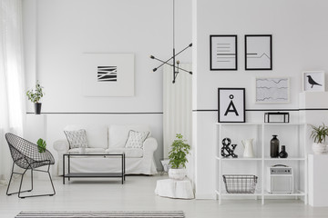 Posters in white apartment interior