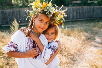 The girl in the embroidered and wreathed smiles.