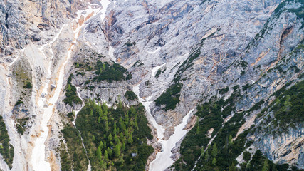 Aerial view of the mudflow with snow high in the Alpine mountains