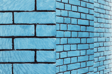 Hallucinogen blue surreal brick wall. Asymmetric angle of exotic cyan fluorescent uneven wall in perspective. Haunted imagination from drugs and alcohol. Geometric background.