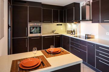 Modern kitchen with a prepared peninsula ready for lunch