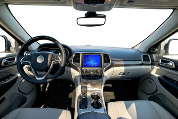Car dashboard and steering wheel. The interior of a modern luxury SUV type car.Kokpit trimmed with leather and decorated with precious wood