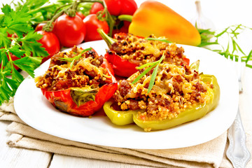 Pepper stuffed with meat and couscous in plate on table