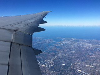 Looking out the window along the wing over Sydney Australia