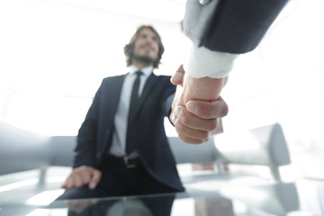 Close-up of two business people shaking hands