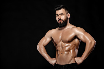 Obraz na płótnie Canvas Handsome strong bodybuilder posing