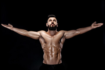 Fototapeta na wymiar strong bodybuilder posing in studio