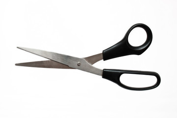 Metal scissors with black pen on white background