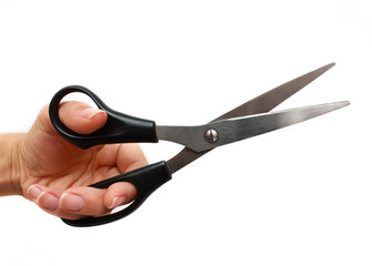 Hand is holding scissors isolated on a white background