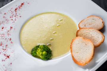 Lentils cream soup on wooden background