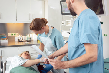 Doctor greeting patient before starting treatment in hospital