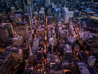 Tall buildings in the city and in the evening from above