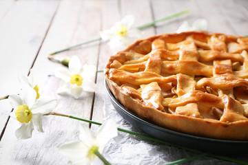 Tasty homemade apple pie on wooden table