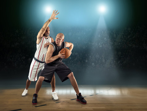 Caucasian Basketball Player in dynamic action with ball 