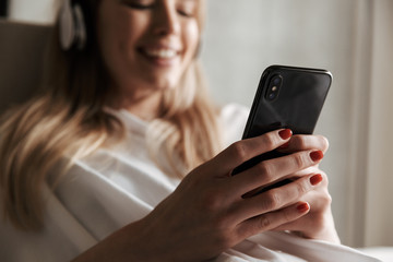 Close up of cheerful woman in headphones