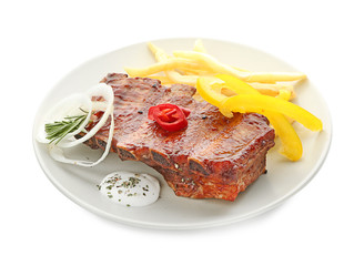 Plate with delicious grilled ribs and french fries on white background