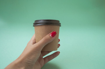 Paper cup on bright background.