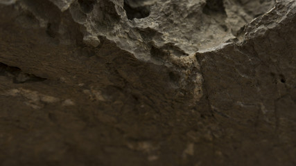 In the piece of rock, the barely visible minerals of the minerals are visible.