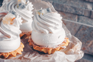 Fresh pastries for breakfast on baking paper, close-up, trend toning