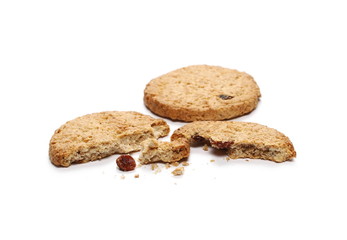 Round whole wheat biscuits with raisins isolated on white background