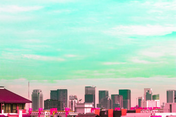 Bird view over cityscape with sun and clouds in the morning.Copy space.Bangkok.Pastel tone