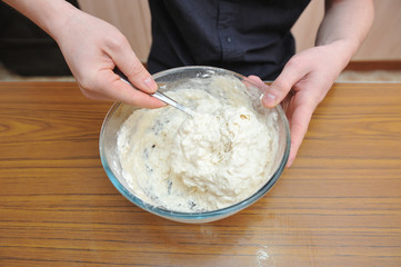 Prepare the dough for homemade pizza, hand knead the dough with yeast