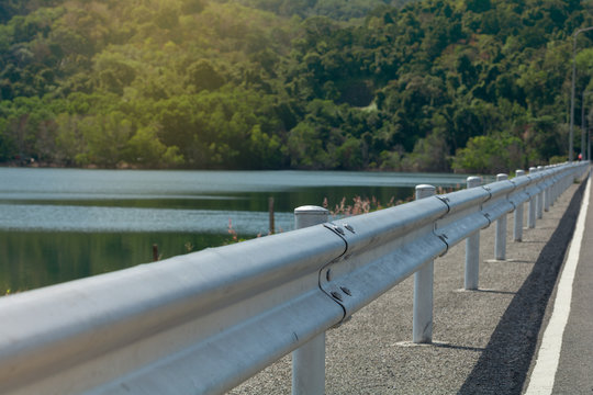Guard rail ..Road barrier on the top of Bang waad dam straight to the mountain.