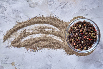 Fototapeta na wymiar Defocused black pepper corns in glass bowl with clipping path on white background, top view, selective focus.