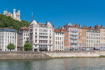 Fototapeta na wymiar Vieux-Lyon, colorful houses in the center, on the river Saone, with the Fourviere cathedral in background 