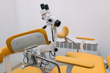 Workplace gynecologist. Gynecological chair, Doctor's chair, Medical lamp, Colposcope with video system