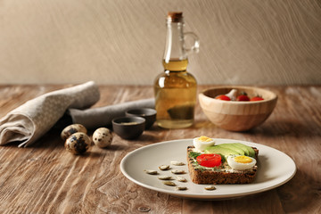 Plate with delicious toast on wooden table