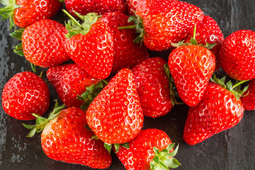 Fresh summer strawberries on a dark background