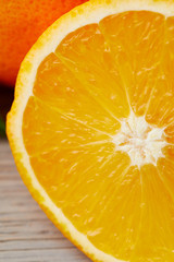 close-up shot of half of orange on wooden surface