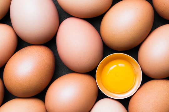 Chicken eggs and egg yolk,top view.