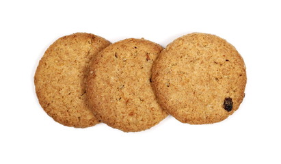 Round wholewheat biscuits with raisins isolated on white background, top view