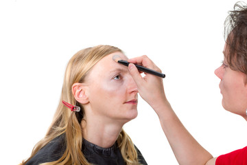 Closeup of a makeup artist applying makeup