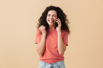 Portrait of a cheerful young girl with curly hair