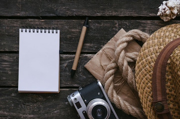 Blank tourist or adventurer notepad diary book. To do list. Note book, photo camera, rope, hat and...